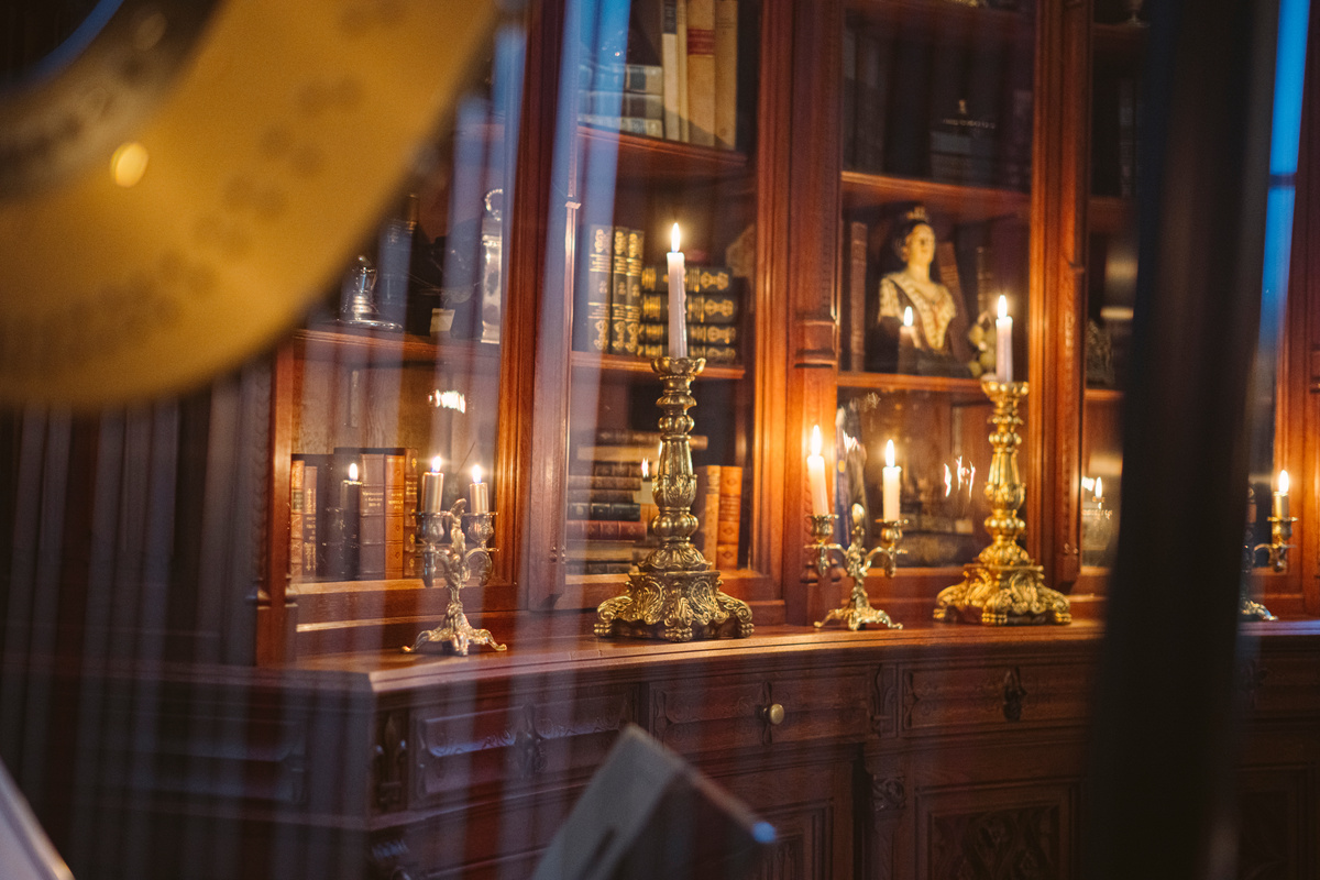 Candelabras glowing in the château library